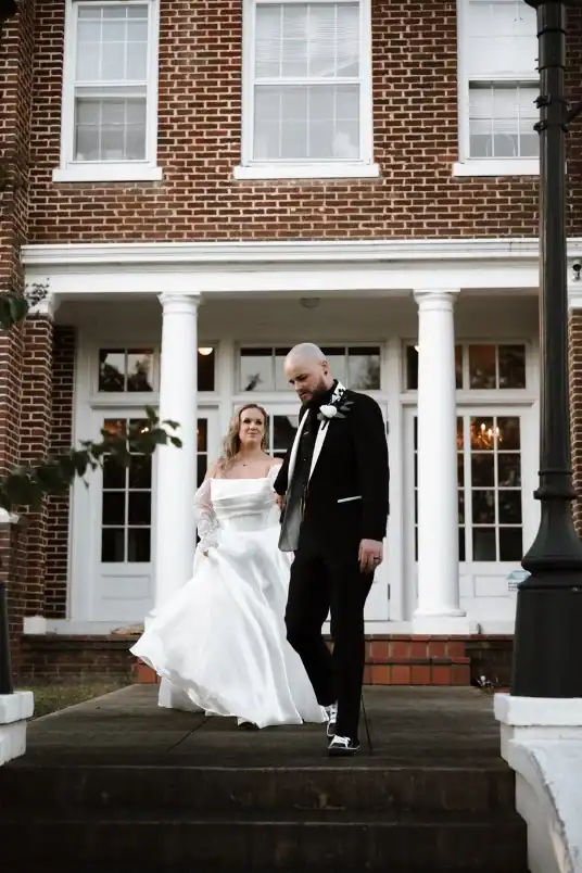 NHP Wedding Venue North Georgia holding hands by staircase